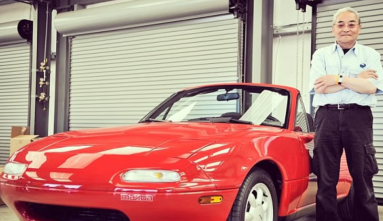Tom Matano with a first generational Mazda Miata